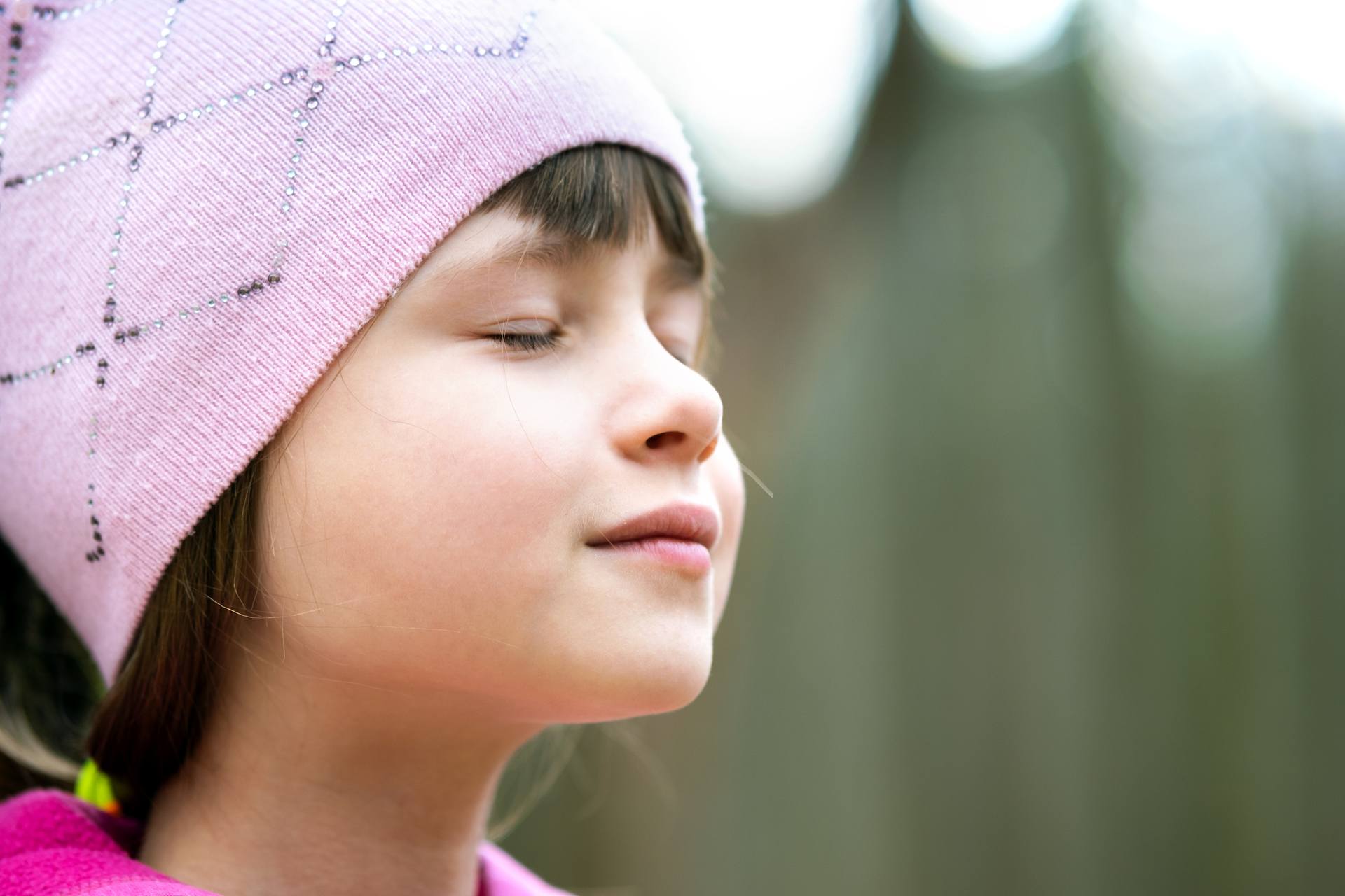 Girl smiling with wind blowing in her face