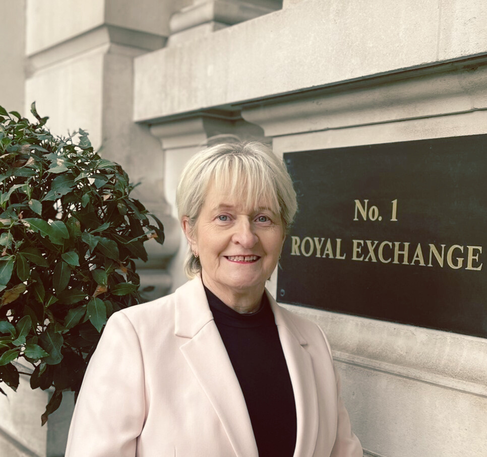 Smiling woman in front of the Royal Exchange