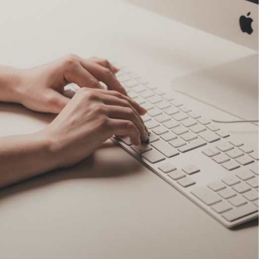 A person's hands on a keyboard