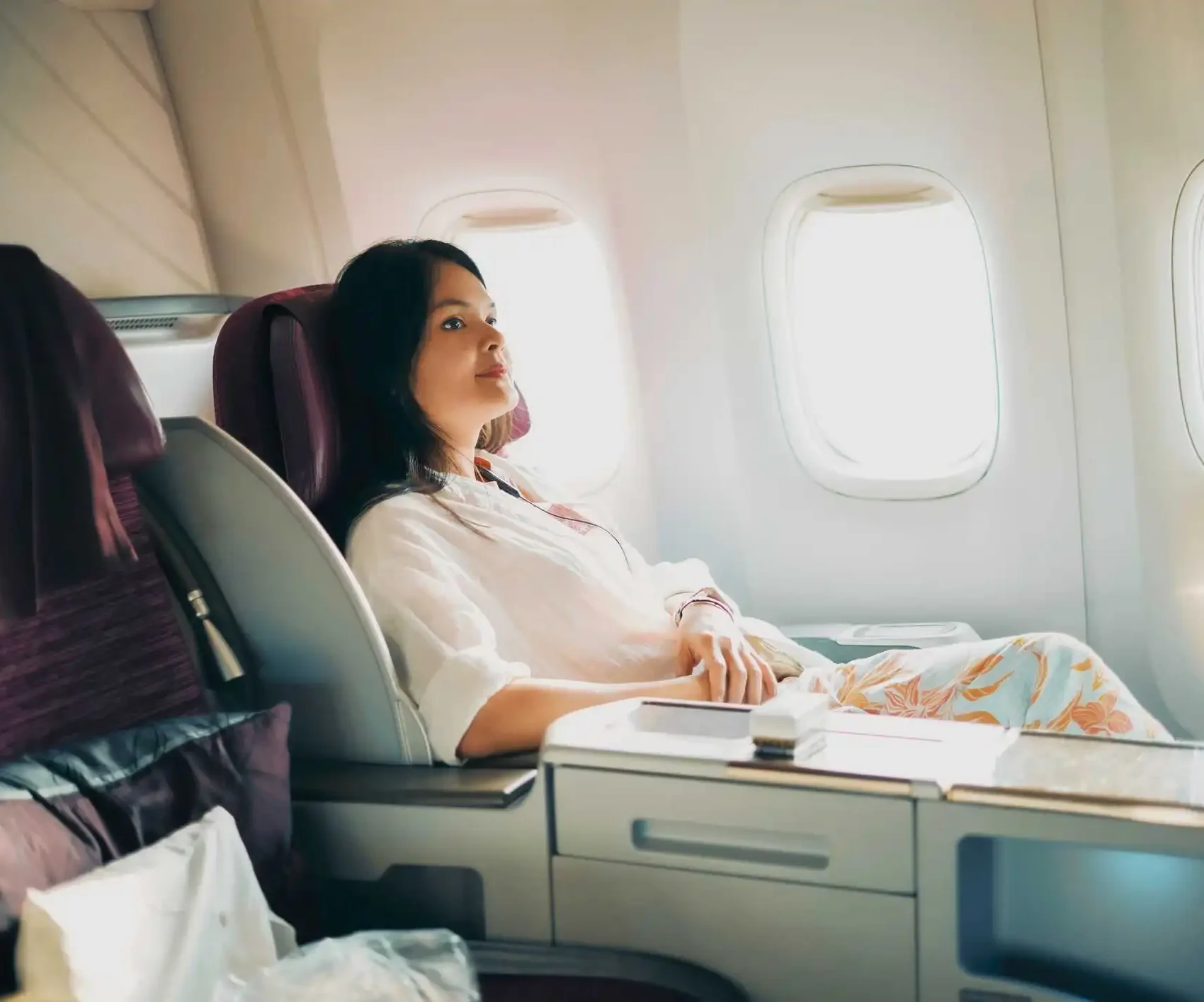 Middle aged woman sitting on a plane