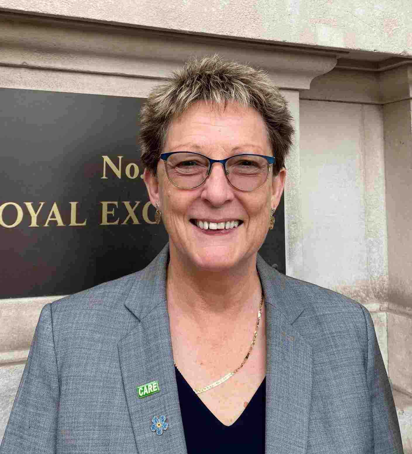 photo of a smiling woman with glasses