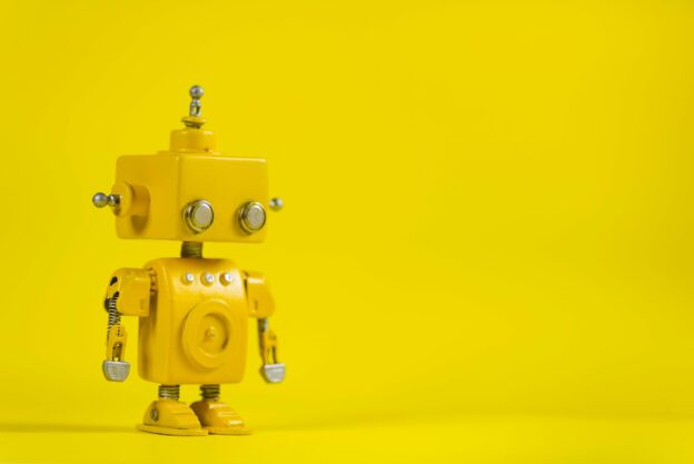 A yellow robot with silver buttons