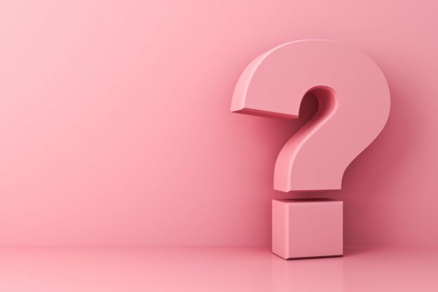 A pink question mark on a pink background