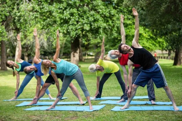 A group of people doing yoga
