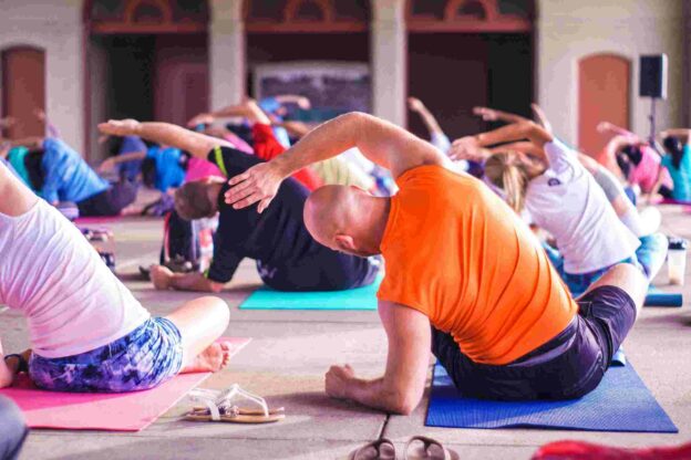 A group of people doing yoga