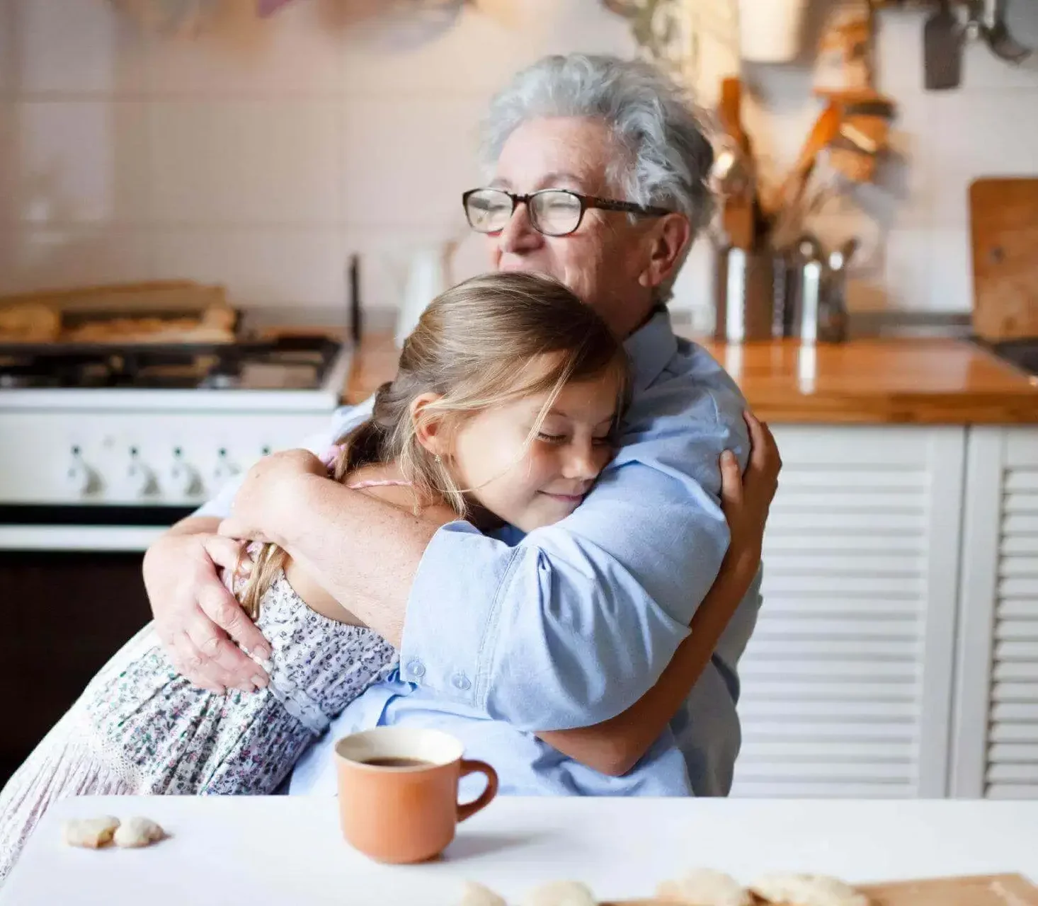 Lady and young girl hugging