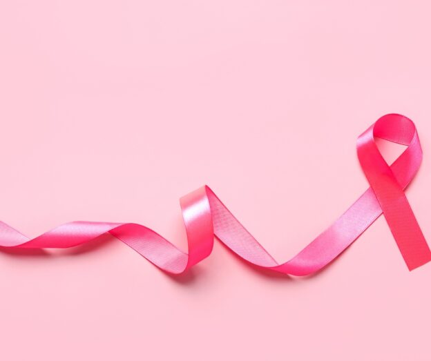 Pink ribbon on a pink background
