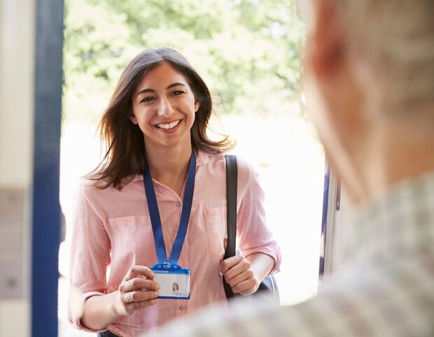 Nurse being welcomed at the clients front door