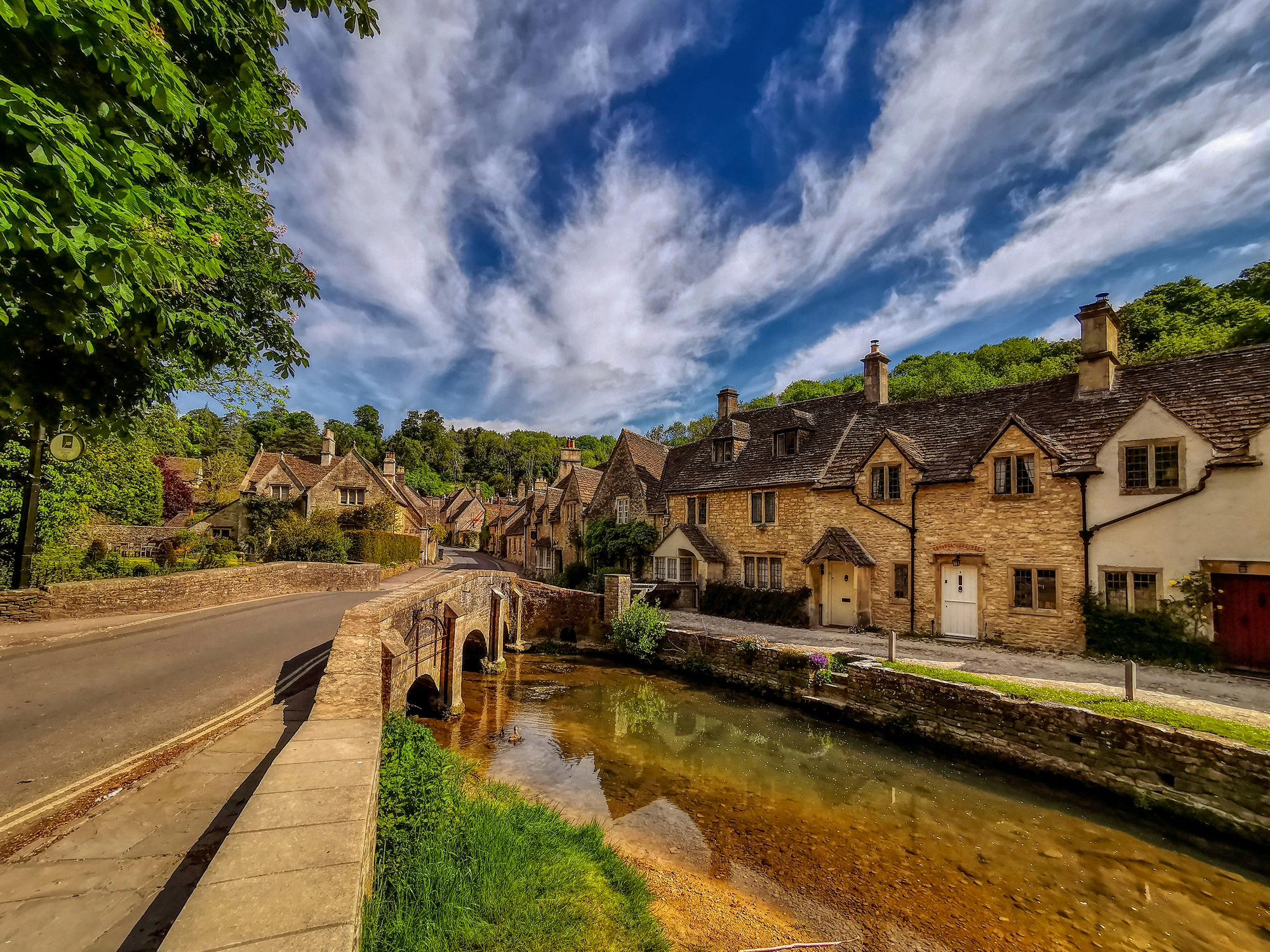 Picturesque village with a bridge and river in Wiltshire
