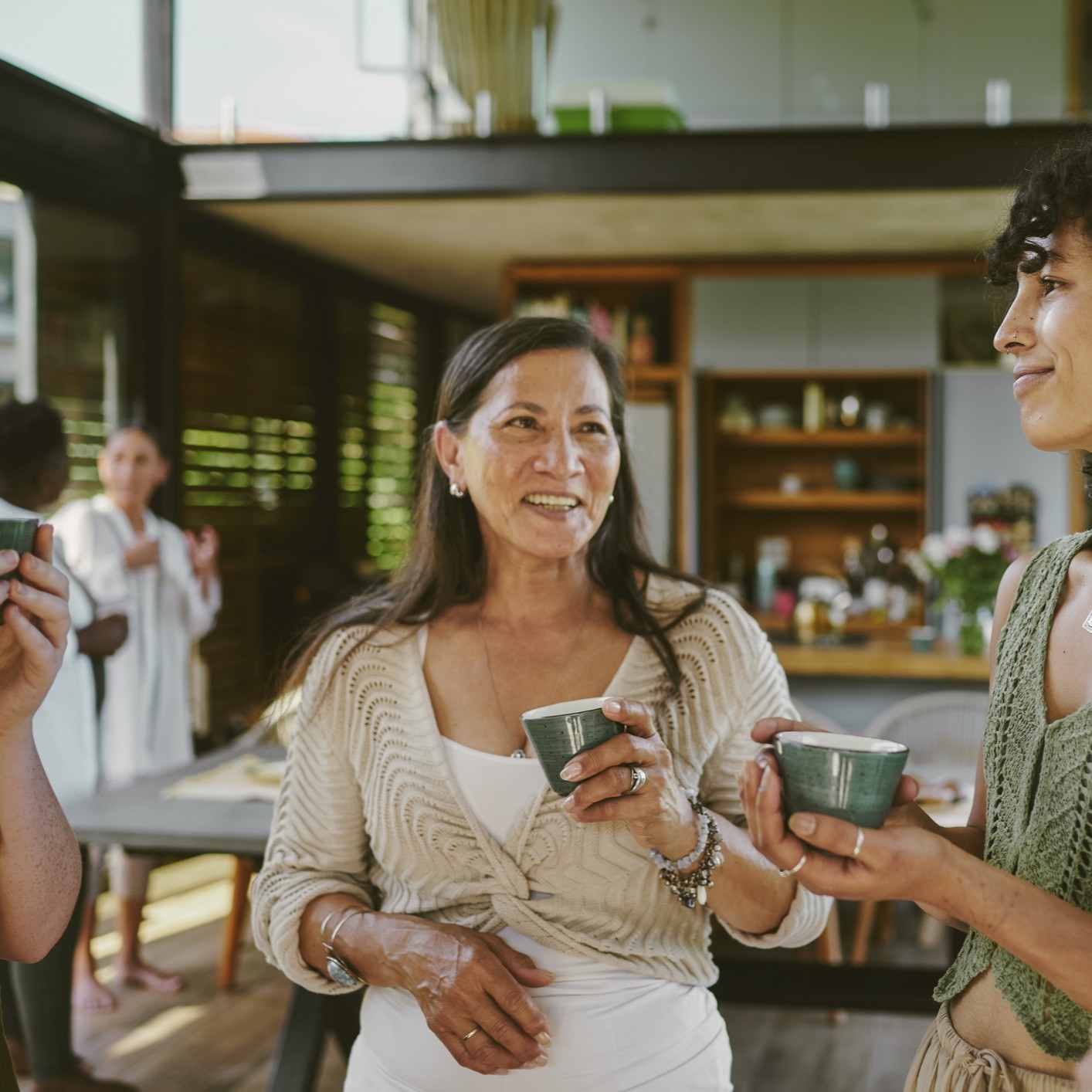 Smiling woman drinking coffee
