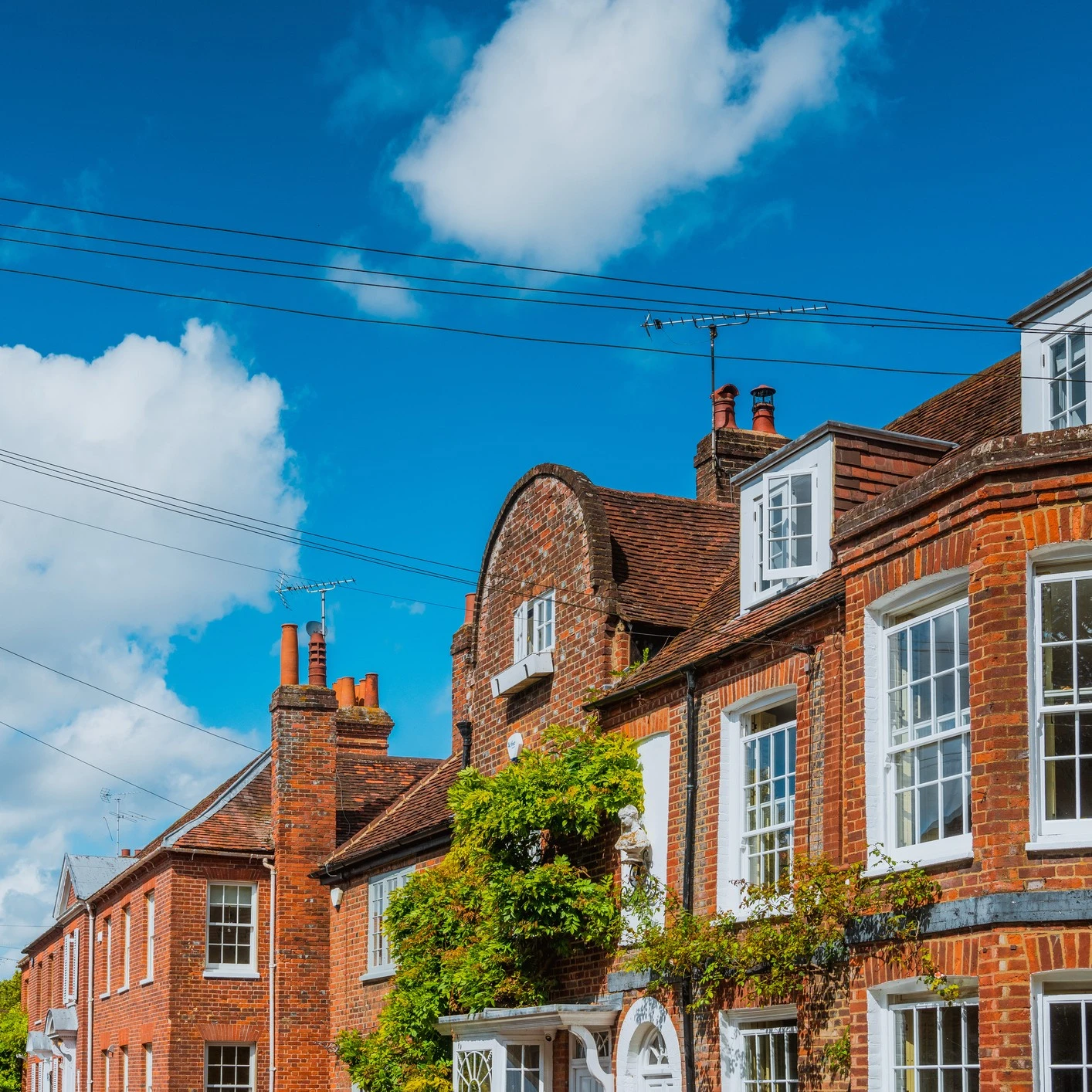 Red brick housing with a Blue sky