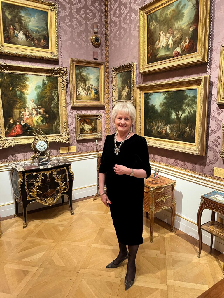 Smiling woman at an art gallery