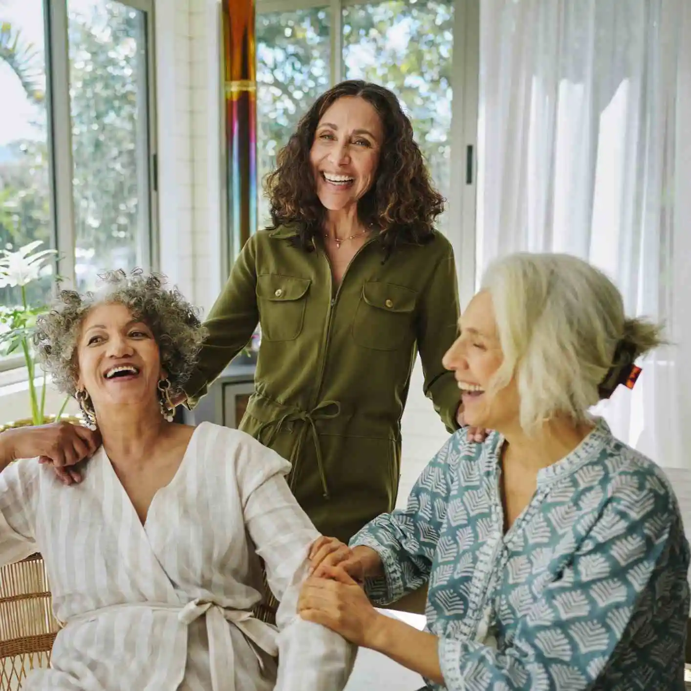 3 Smiling mature women at home