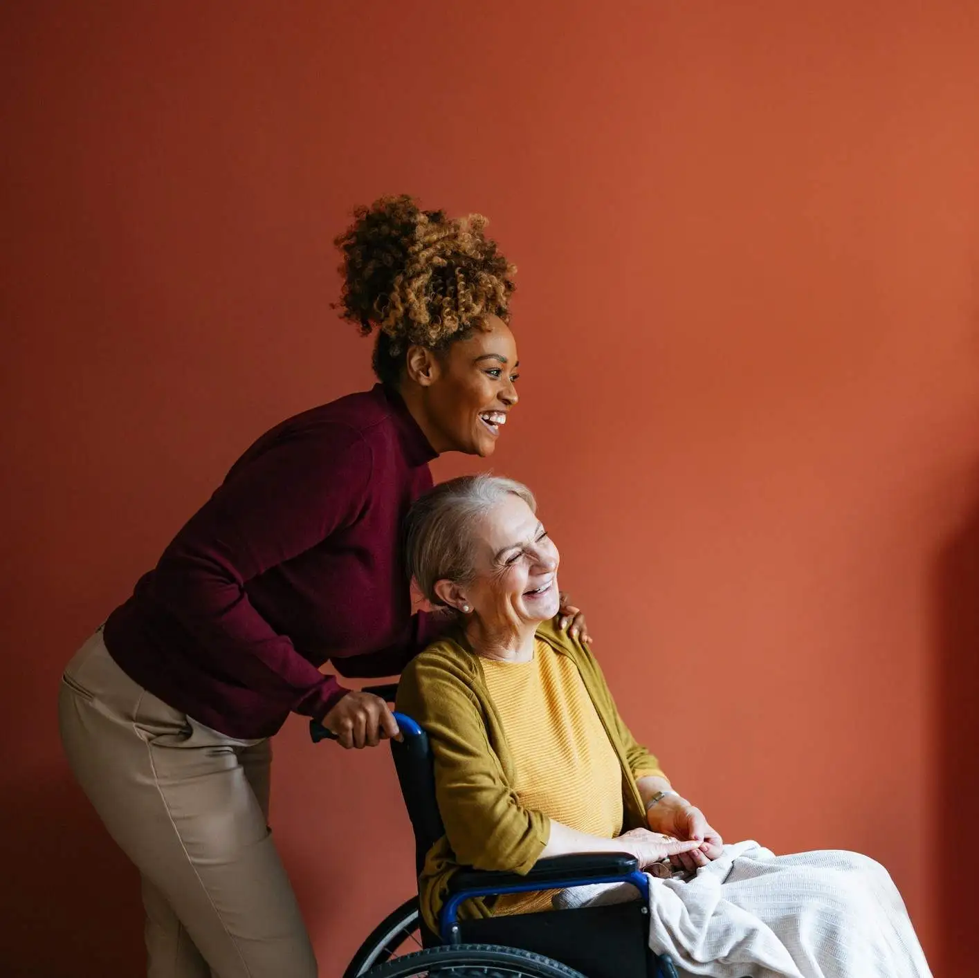 Carer with woman in a wheelchair